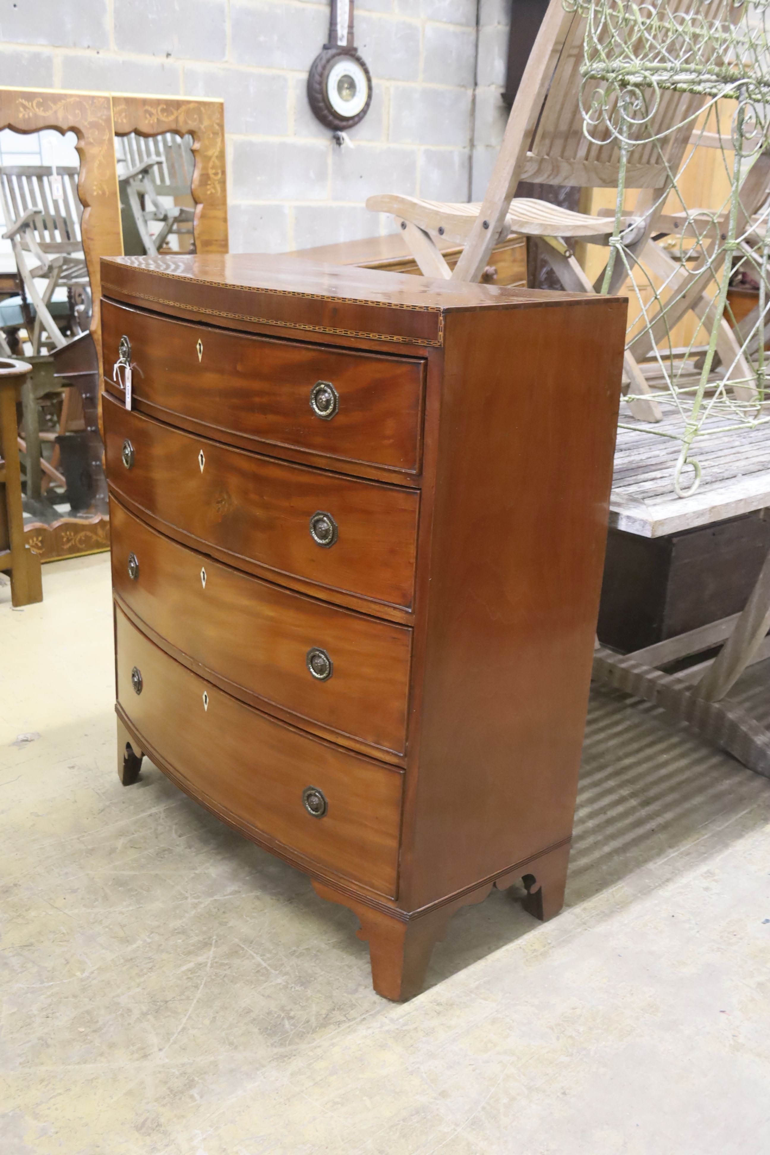 A Regency banded mahogany bowfront chest of drawers, width 92cm, depth 45cm, height 109cm